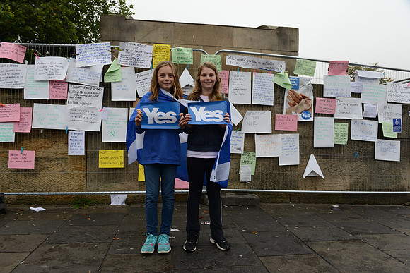 Scotland Referendum Day, YOung Scottish girls wrapped in flags supporting the Yes vote